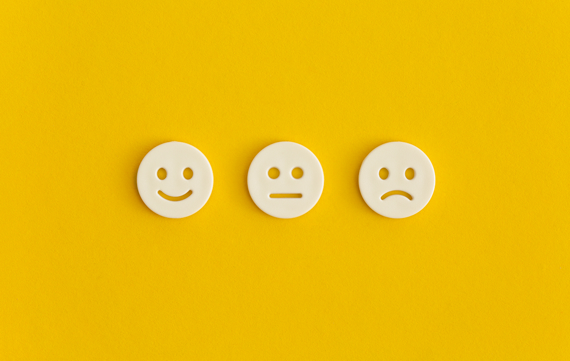 Emoticon smile on a yellow background. Customer feedback.